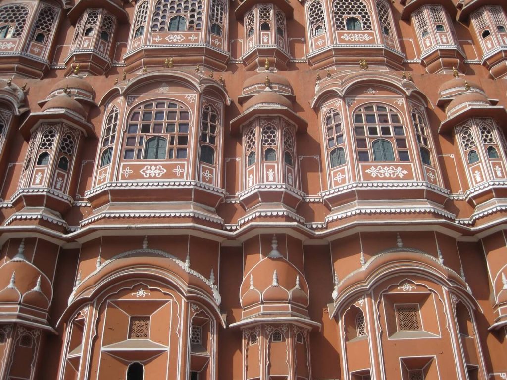 Photo by LizHilton from Pixabay The Hawa Mahal palace window view, ‘Palace of Winds’ and ‘Palace of the Breeze’, Rajput dynasty, Jaipur, Rajasthan, India